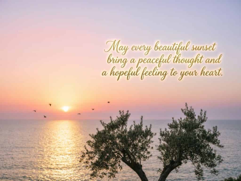 Sunset over the ocean with inspirational quote about peace and hope