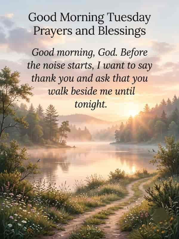 A peaceful morning landscape featuring a dirt path along a calm lake at sunrise, with soft golden light filtering through surrounding pine trees and wildflowers, overlaid with text reading: "Good Morning Tuesday Prayers and Blessings" and "Good morning, God. Before the noise starts, I want to say thank you and ask that you walk beside me until tonight."